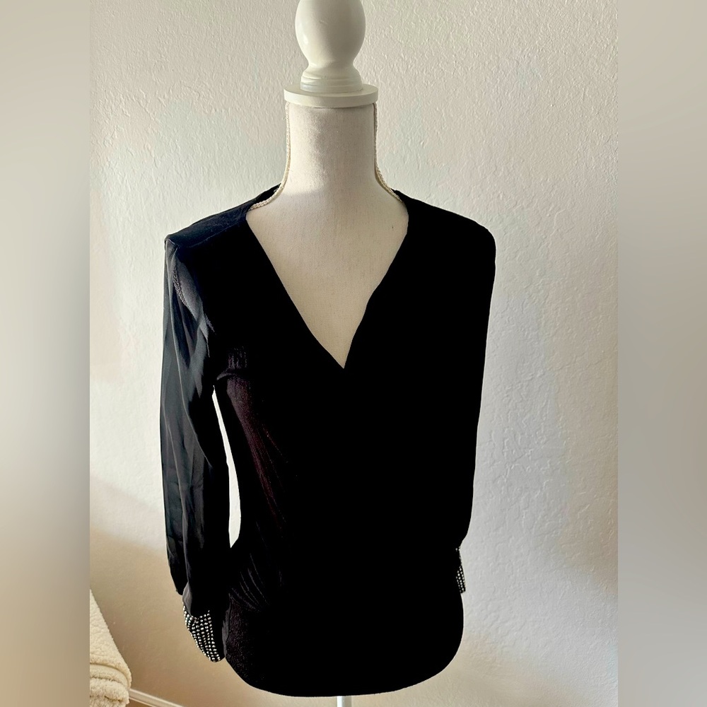 Black soft blouse with silver wrist studs